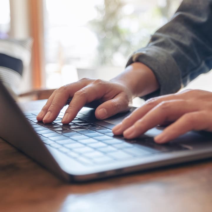 Person searching something on a laptop